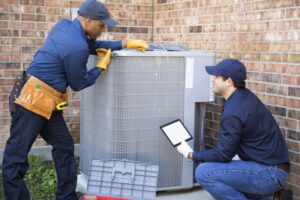 two-techs-working-on-air-conditioner